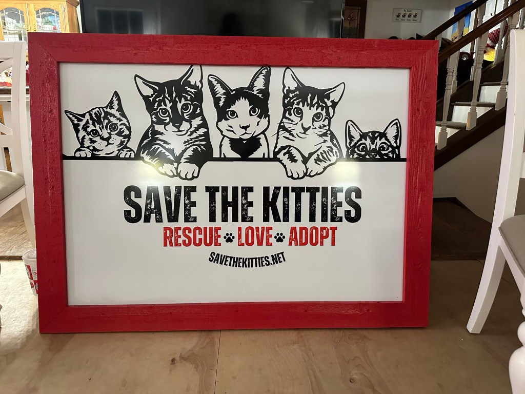 Save the Kitties, a cat rescue, signage including their website savethekitties,net,