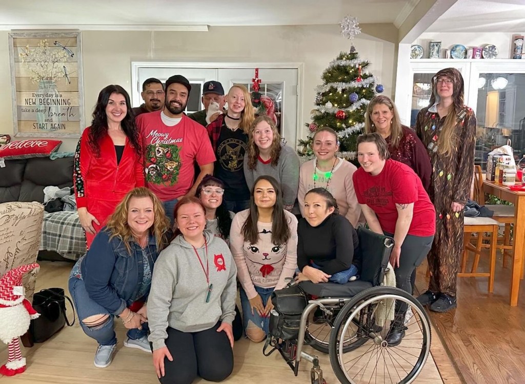Fourteen volunteers of Save the Kitties, a cat rescue, at their annual Christmas party. 